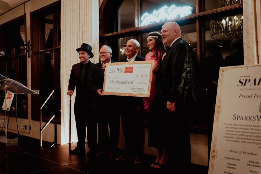 Spark the Springs receiving an award 